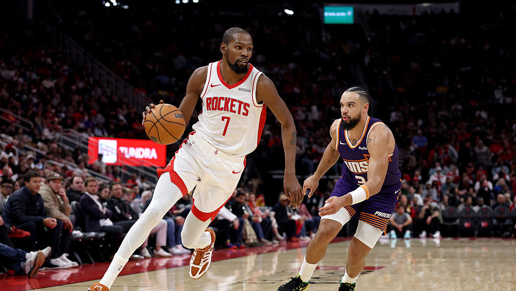 Kevin Durant #7 of the Houston Rockets drives to the basket against Dillon Brooks #3 of the Phoenix...