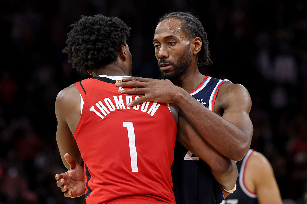 HOUSTON, TEXAS - DECEMBER 11: Amen Thompson #1 of the Houston Rockets greets Kawhi Leonard #2 of the Los Angeles Clippers after the game at Toyota Center on December 11, 2025 in Houston, Texas. NOTE TO USER: User expressly acknowledges and agrees that, by downloading and or using this photograph, User is consenting to the terms and conditions of the Getty Images License Agreement. (Photo by Tim Warner/Getty Images)