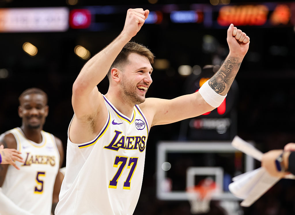 PHOENIX, ARIZONA - DECEMBER 14: Luka Doncic #77 of the Los Angeles Lakers reacts after making a three-point shot during the second half of a game against the Phoenix Suns at Mortgage Matchup Center on December 14, 2025 in Phoenix, Arizona. NOTE TO USER: User expressly acknowledges and agrees that, by downloading and or using this photograph, User is consenting to the terms and conditions of the Getty Images License Agreement. (Photo by Mike Christy/Getty Images)