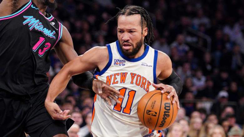 NEW YORK, NEW YORK - DECEMBER 21: Jalen Brunson #11 of the New York Knicks goes to the basket as Bam Adebayo #13 of the Miami Heat defends in the first half at Madison Square Garden on December 21, 2025 in New York City. NOTE TO USER: User expressly acknowledges and agrees that, by downloading and or using this photograph, User is consenting to the terms and conditions of the Getty Images License Agreement. (Photo by Evan Bernstein/Getty Images)