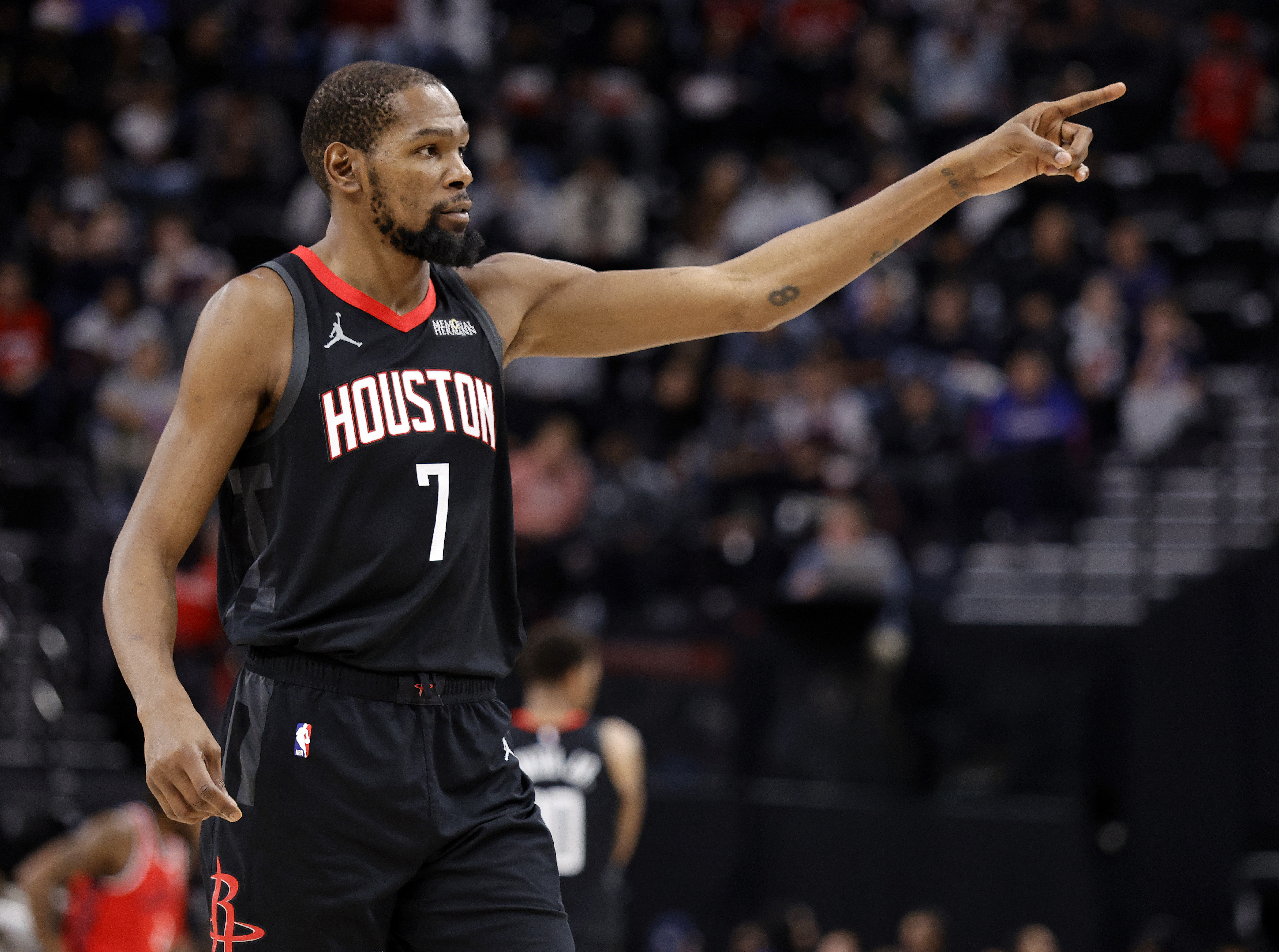 Houston Rockets star Kevin Durant gestures during the first half...