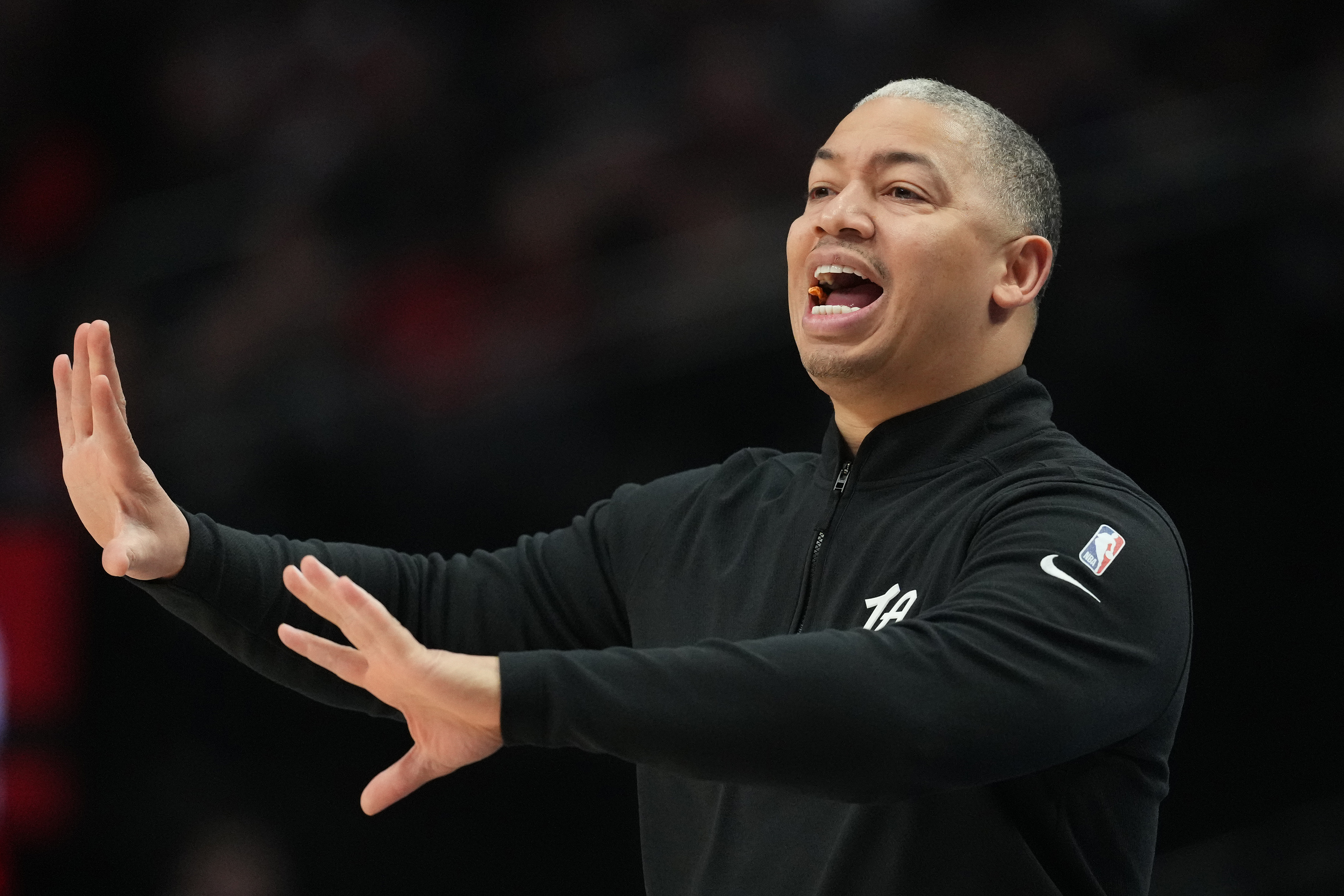 Clippers head coach Tyronn Lue instructs his players from the...