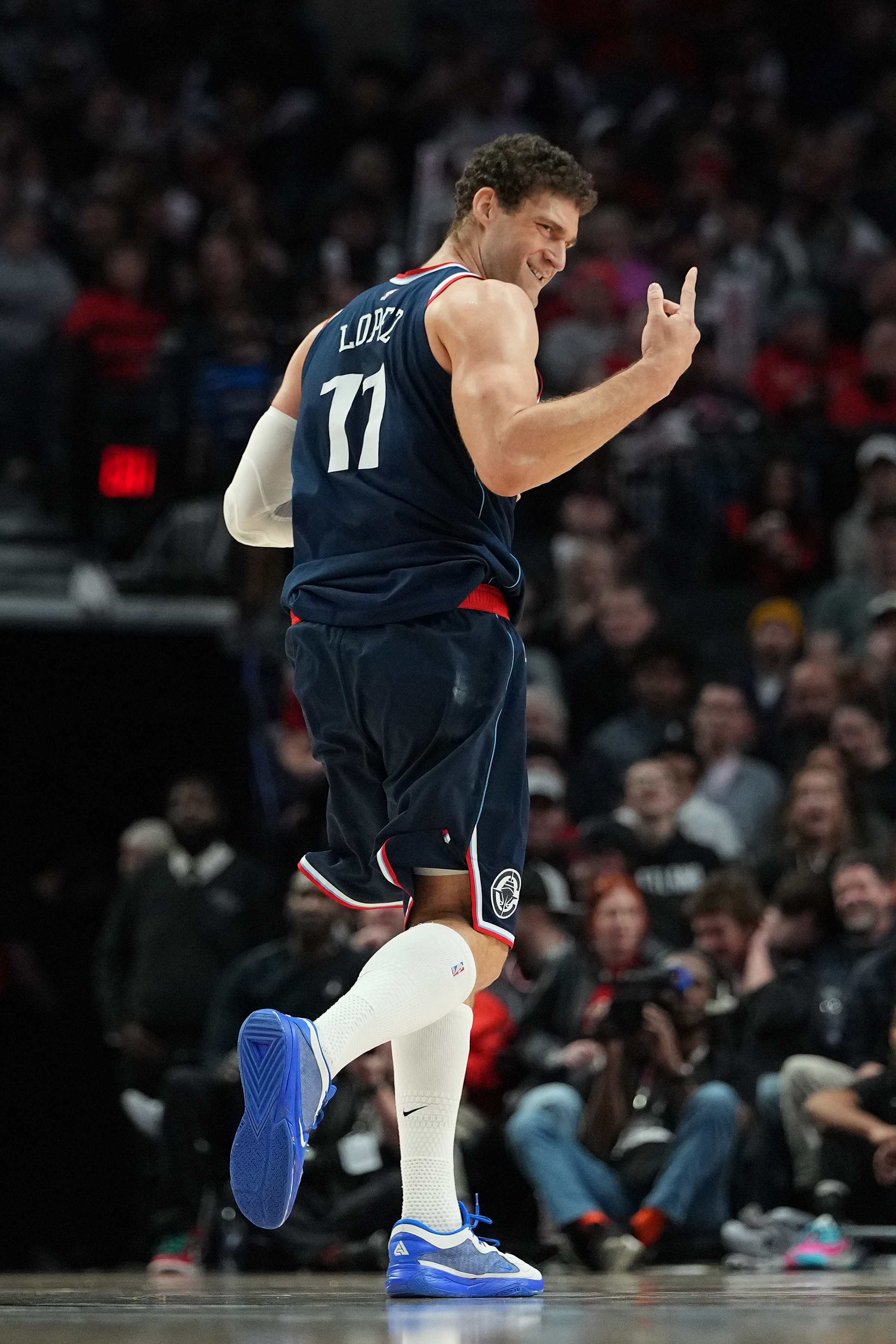 Clippers center Brook Lopez celebrates after making a 3-point shot...