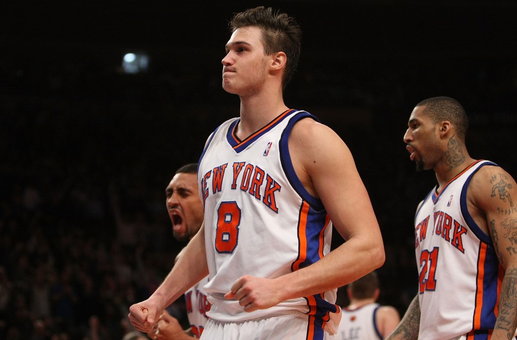 Danilo Gallinari #8 of the New York Knicks celebrates after taking a charge in the fourth quarter against the Los Angeles Clippers at Madison Square Garden on December 18, 2009 in New York, New York.