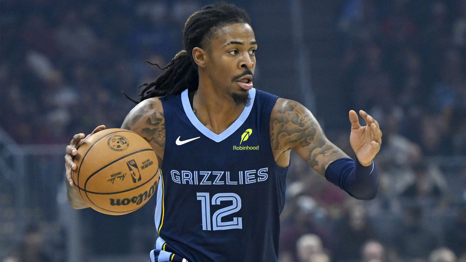 Grizzlies guard Ja Morant (12) dribbles the ball in the first quarter against the Cleveland Cavaliers at Rocket Arena