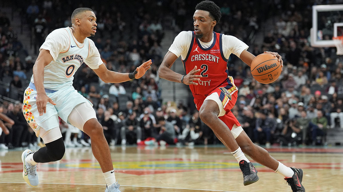 New Orleans Pelicans forward Herbert Jones (2) dribbles against San Antonio Spurs forward Keldon Johnson (0) in the first half at Frost Bank Center.
