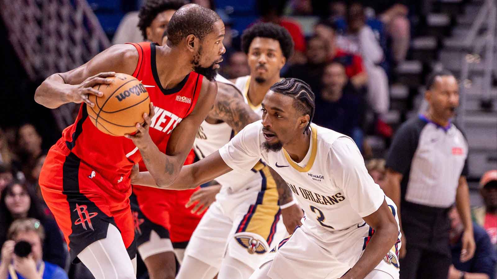 Houston Rockets forward Kevin Durant (7) dribbles against New Orleans Pelicans forward Herbert Jones (2) during the first half at Smoothie King Center.