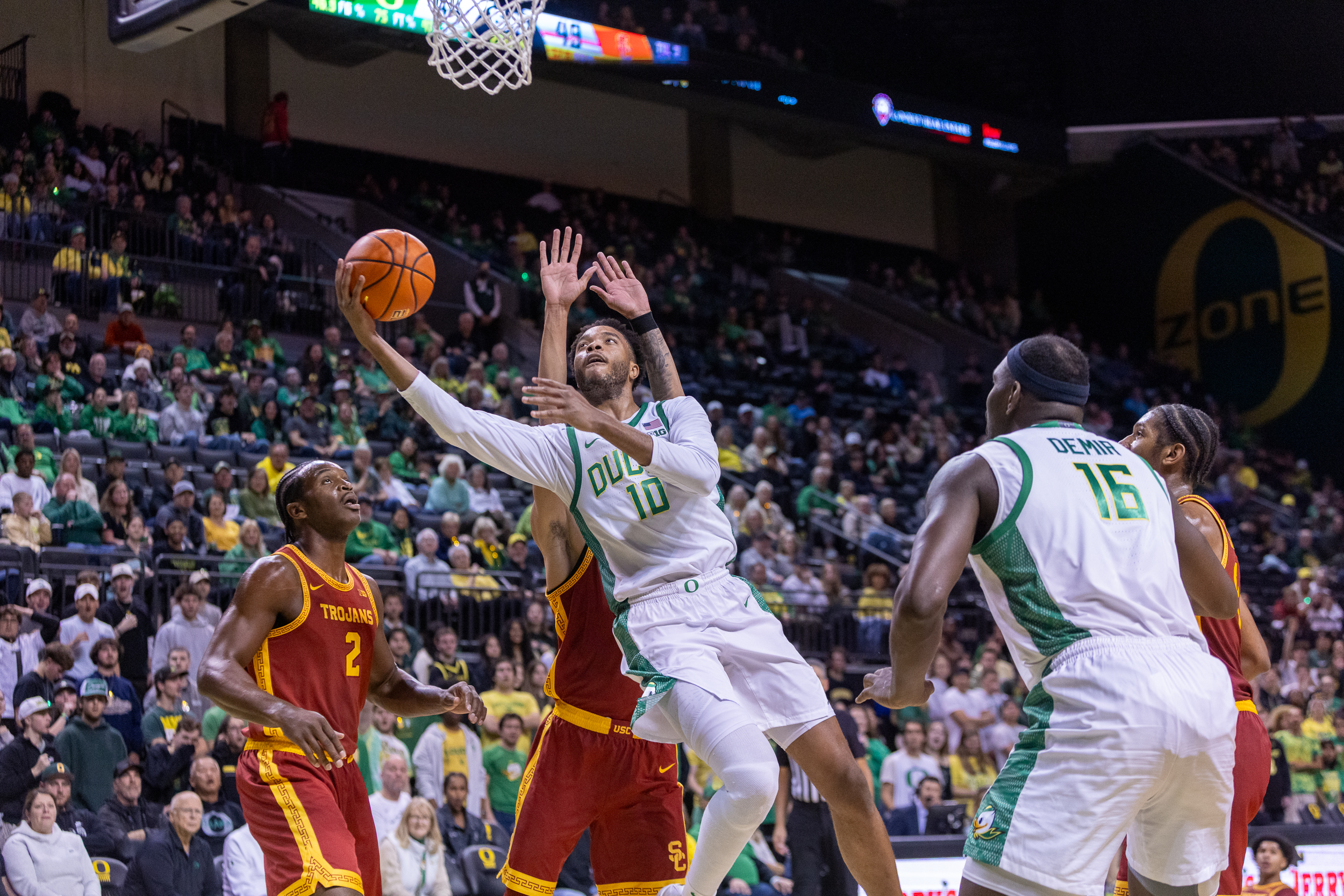 Oregon forward Kwame Evans Jr. scores at the basket as the Ducks face the USC Trojans in a Big Ten men’s college basketball at Matthew Knight Arena in Eugene on Tuesday, Dec. 2, 2025.