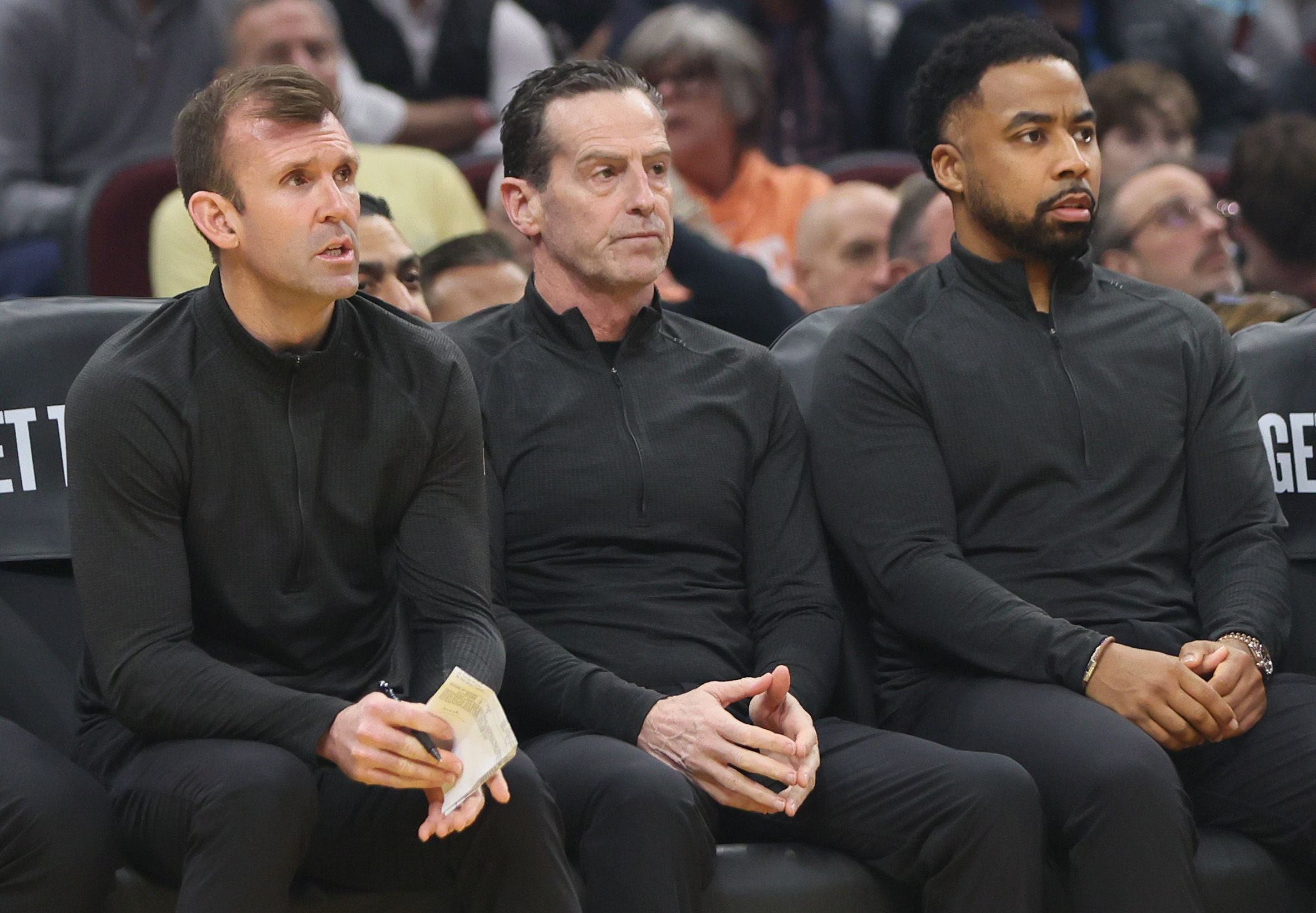 Cleveland Cavaliers coaches (L-R) assistant coach Mike Gerrity, head coach Kenny Atkinson and associate head coach Johnnie Bryant on the bench against the Charlotte Hornets at Rocket Arena.