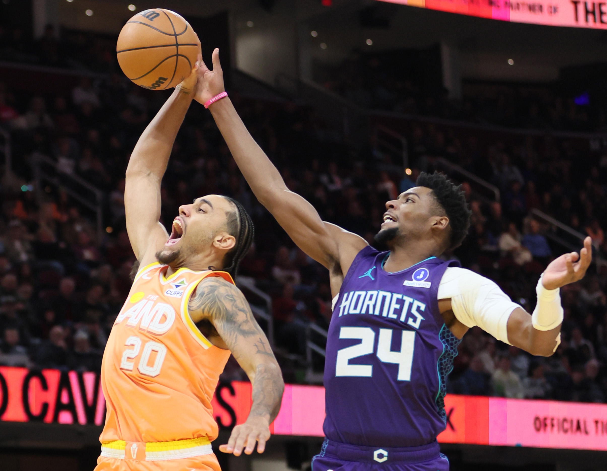 Cleveland Cavaliers guard Jaylon Tyson goes up for a dunk attempt as Charlotte Hornets forward Brandon Miller gets to the basketball in the second half at Rocket Arena.