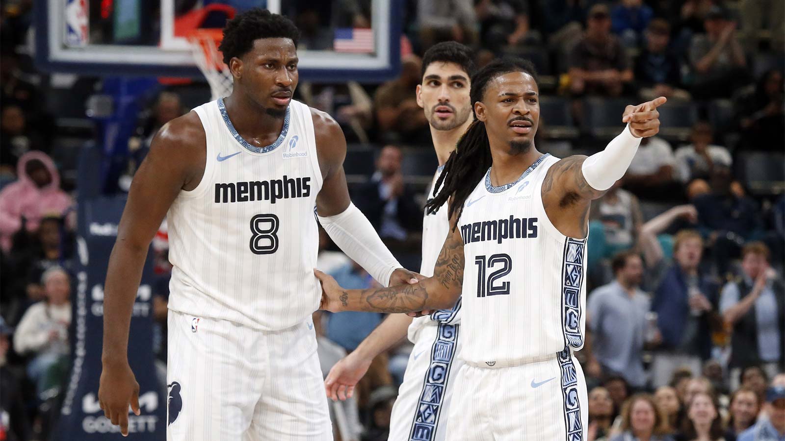 Memphis Grizzlies guard Ja Morant (12) reacts with forward/center Jaren Jackson Jr. (8) during the fourth quarter against the Milwaukee Bucks at FedExForum.