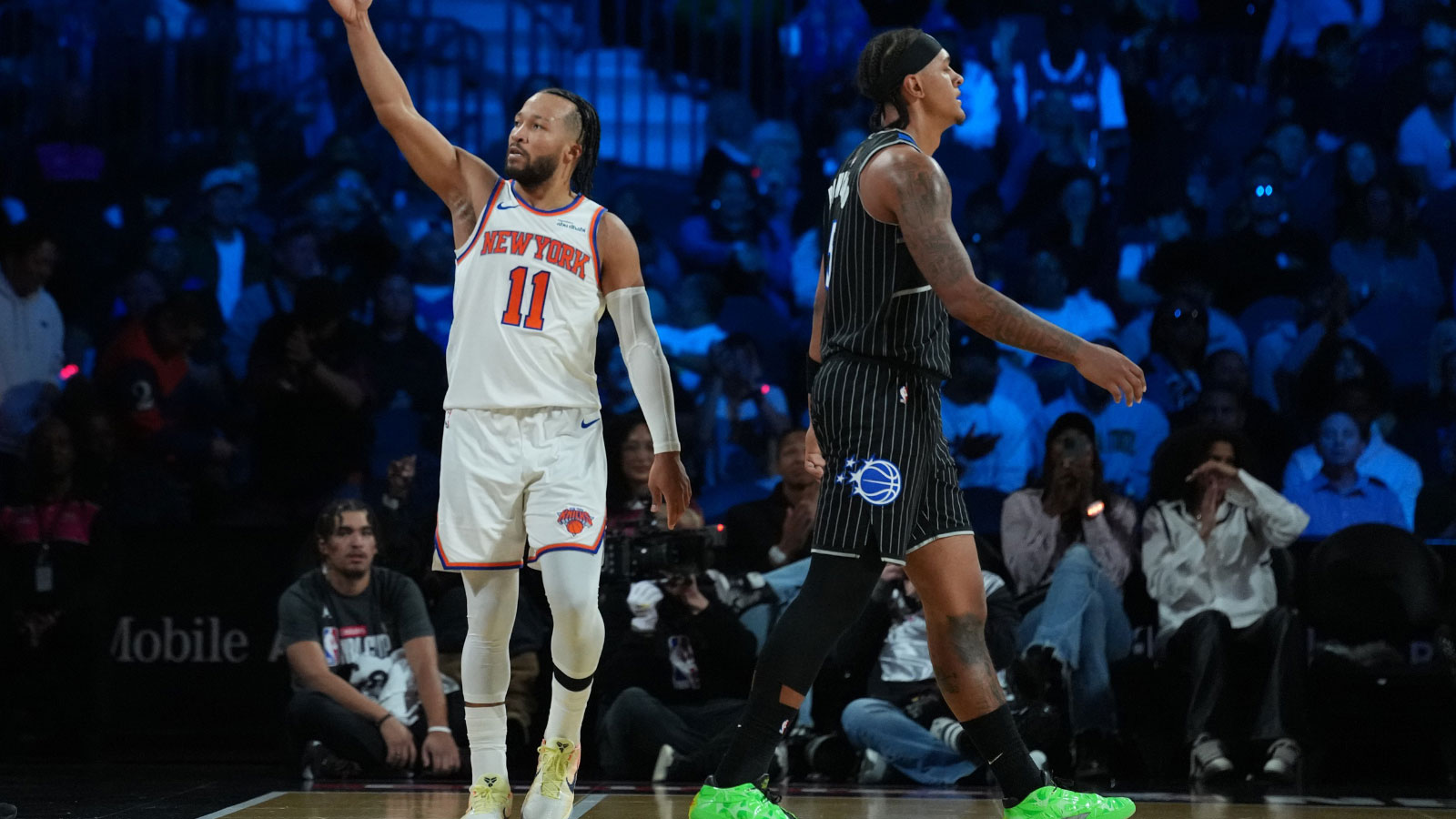 New York Knicks guard Jalen Brunson (11) reacts as Orlando Magic forward Paolo Banchero (5) walks away during the third quarter at T-Mobile Arena. 