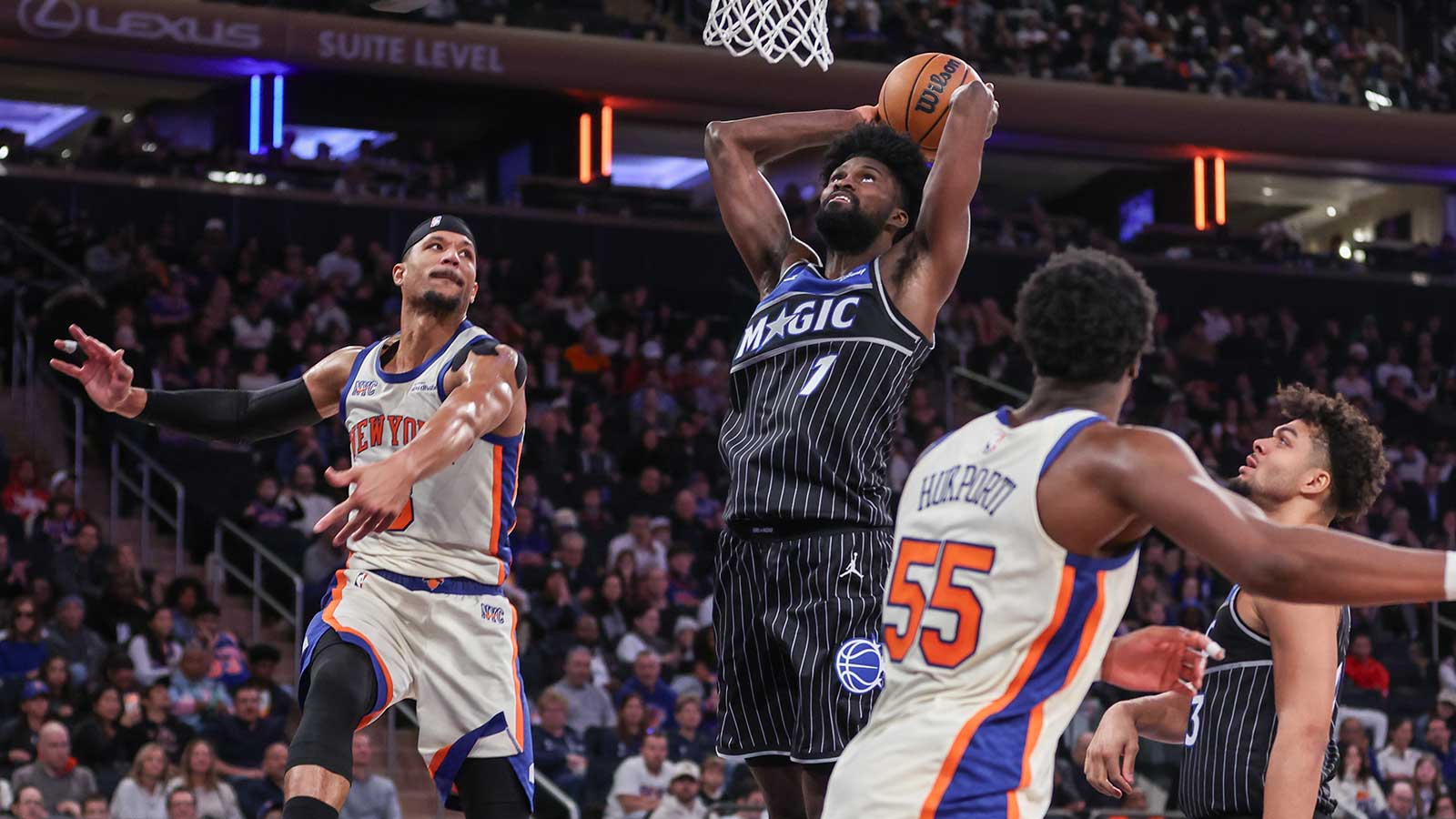 Orlando Magic forward Jonathan Isaac (1) looks to drive past New York Knicks guard Josh Hart (3) for a dunk attempt in the fourth quarter at Madison Square Garden. 
