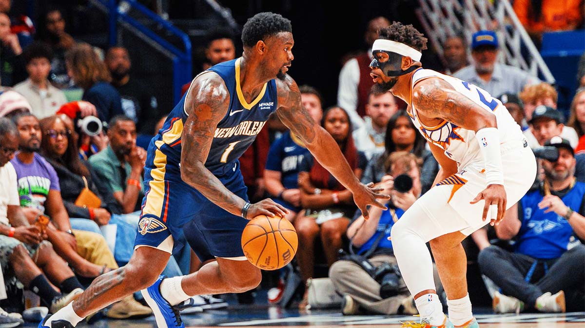 New Orleans Pelicans forward Zion Williamson (1) dribbles against Phoenix Suns guard Jordan Goodwin (23) during the first half at Smoothie King Center.
