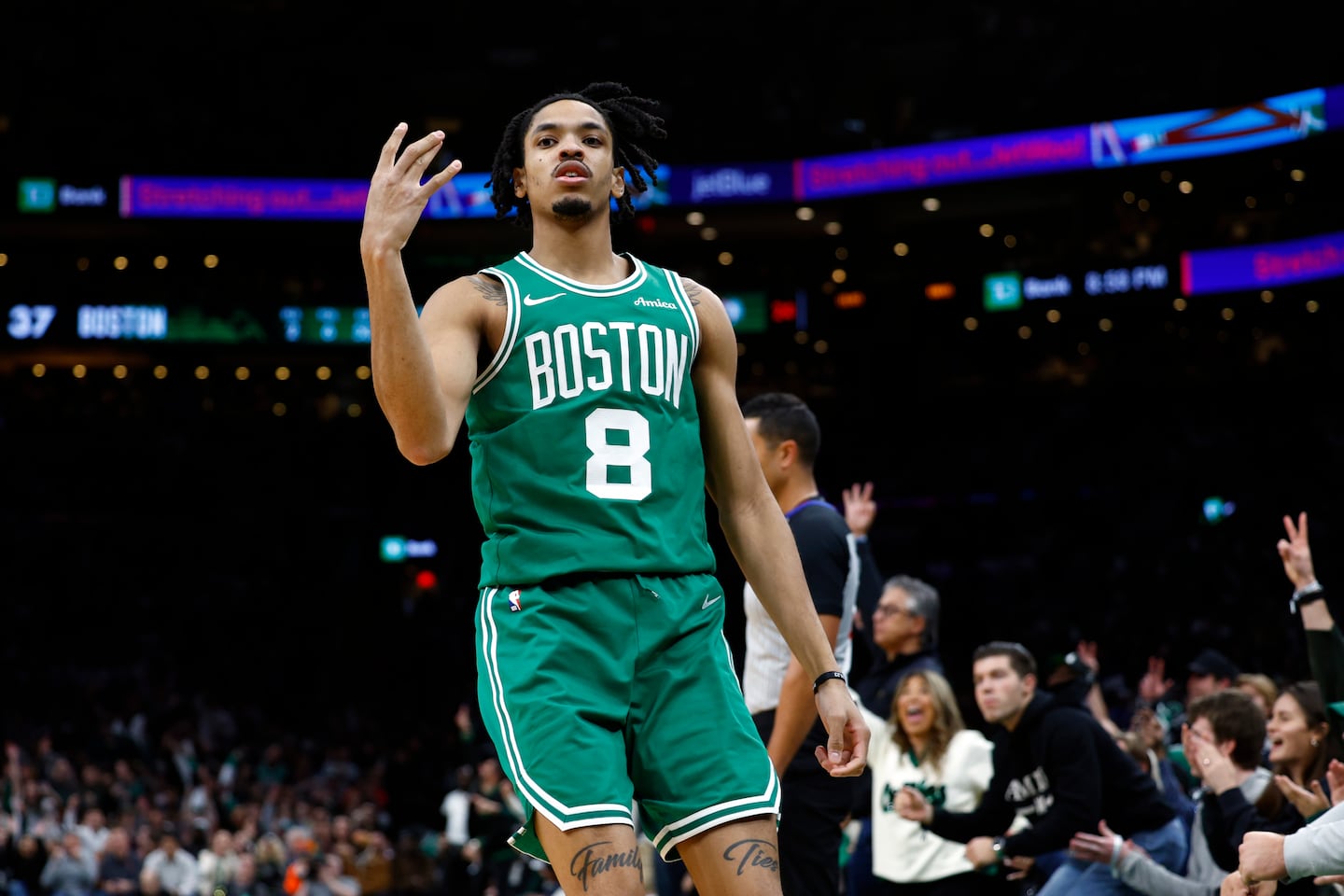 The Celtics' Josh Minott celebrates a 3-pointer in the second quarter. 