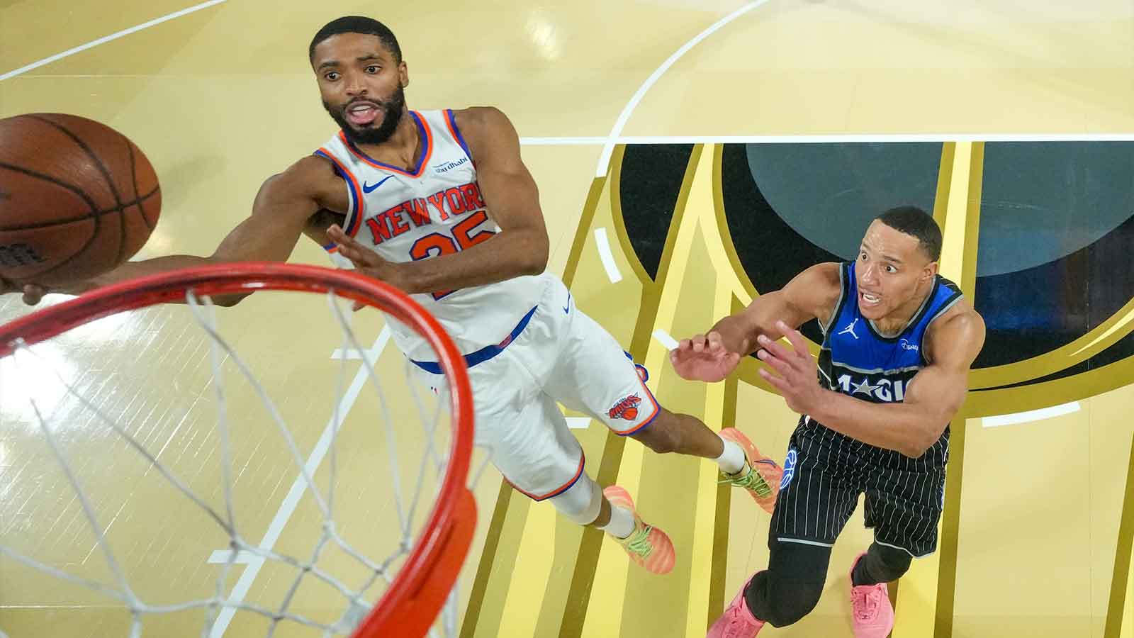 New York Knicks guard Mikal Bridges (25) puts the shot up as Orlando Magic guard Desmond Bane (3) looks on during a game at T-Mobile Arena. 