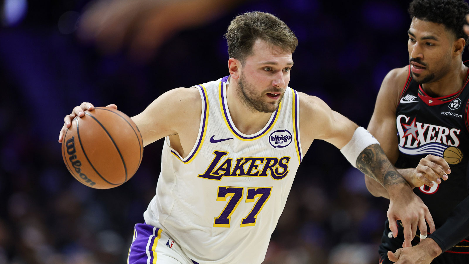Lakers guard Luka Doncic (77) drives against Philadelphia 76ers guard Quentin Grimes (5) during the second quarter at Xfinity Mobile Arena