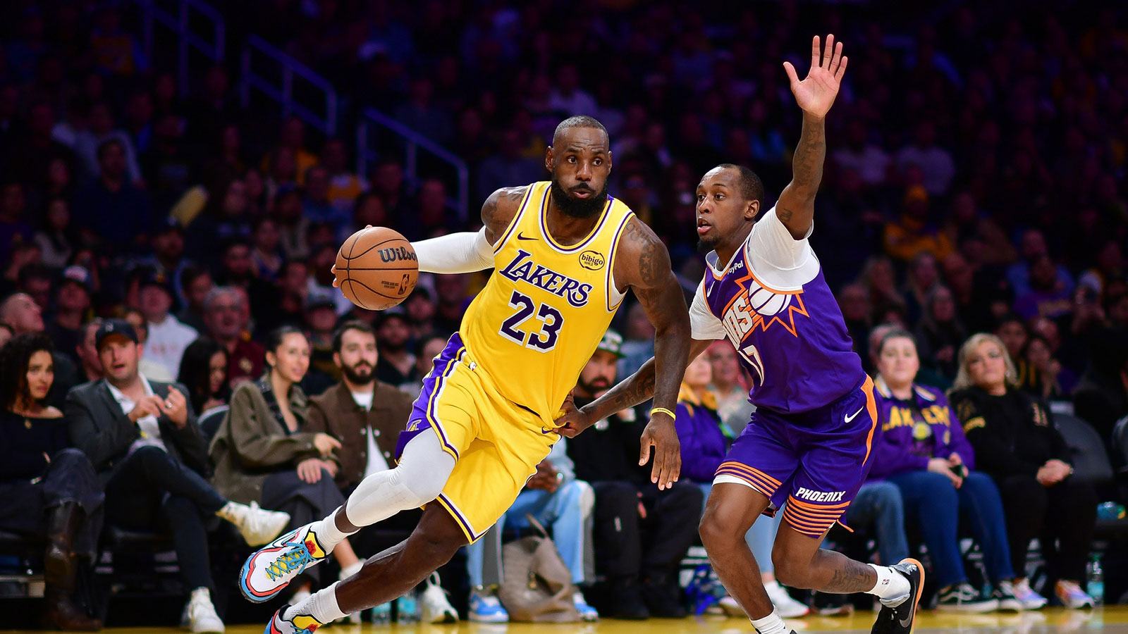 Dec 1, 2025; Los Angeles, California, USA; Los Angeles Lakers forward LeBron James (23) moves the ball against Phoenix Suns guard Jordan Goodwin (23) during the second half at Crypto.com Arena. Mandatory Credit: Gary A. Vasquez-Imagn Images