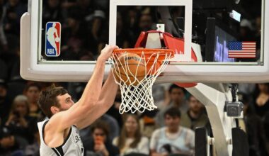 San Antonio Spurs center Luke Kornet dunks the ball against the Washington Wizards during the first half of an NBA basketball game in San Antonio, Thursday, Dec. 18, 2025. (AP Photo/Billy Calzada)