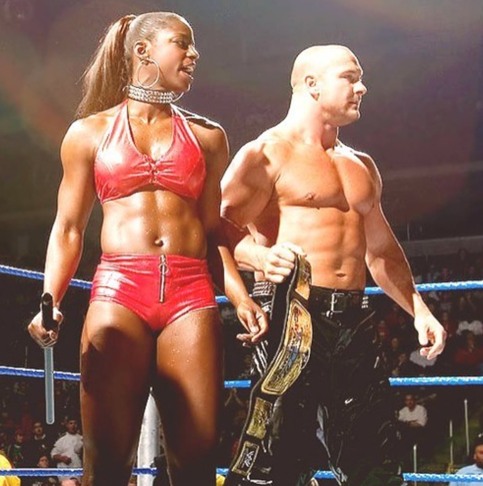 WWE superstar Shaniqua stands in the ring with one of the Basham Brothers during a match. CONTRIBUTED PHOTO