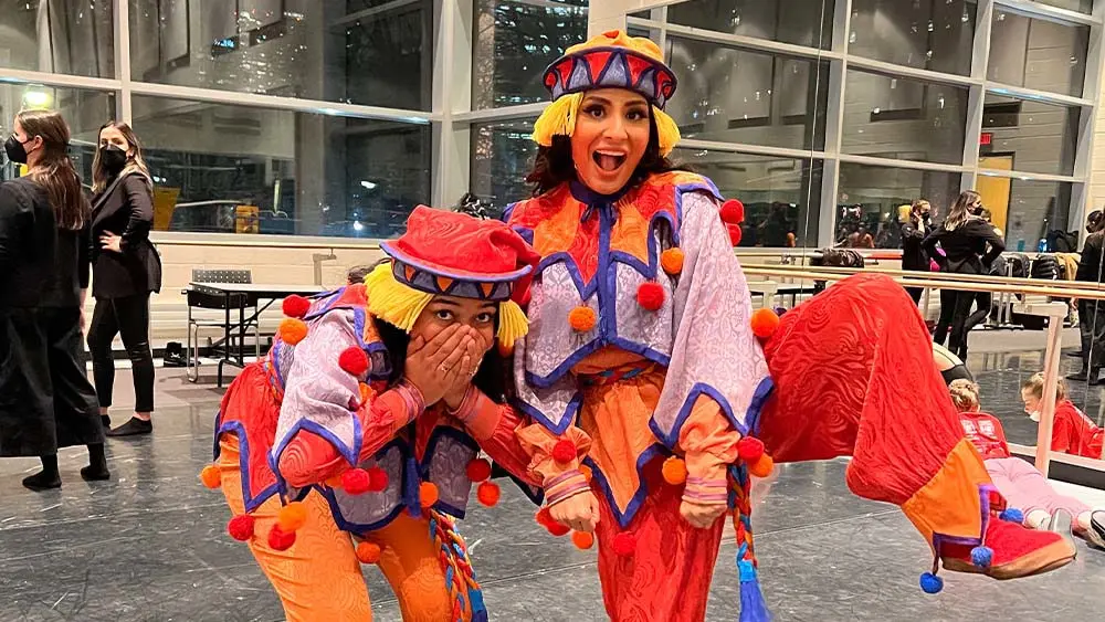 Vibrant costumes of performers from NOW Toronto arts event, lively entertainment, and cultural celebration in Toronto's arts scene.