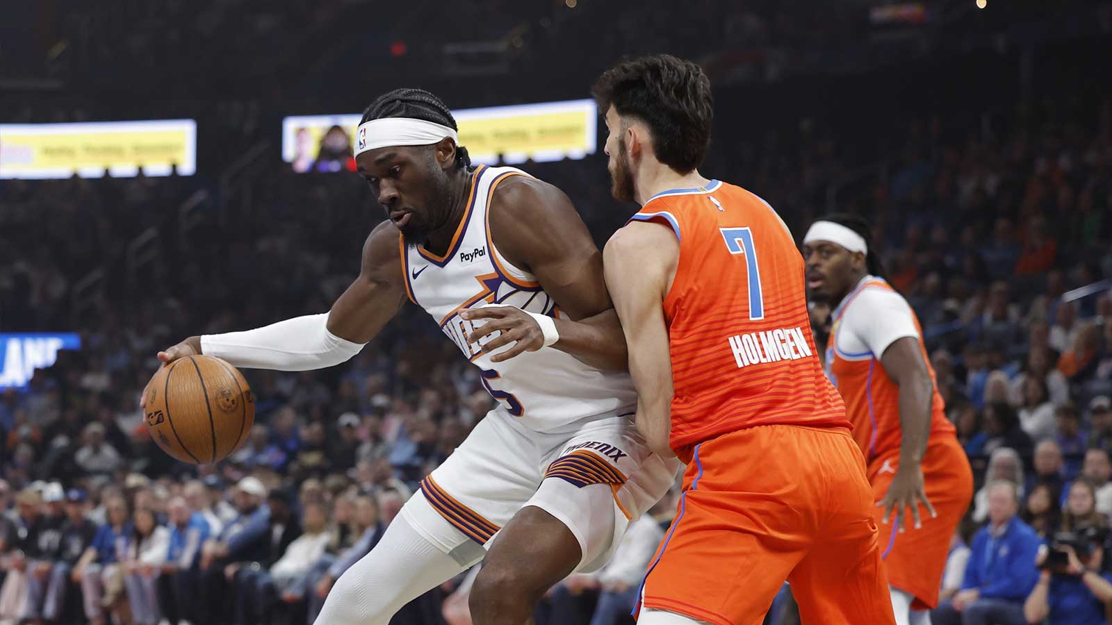 Phoenix Suns center Mark Williams (15) moves the ball against Oklahoma City Thunder center Chet Holmgren (7) during the first quarter at Paycom Center.