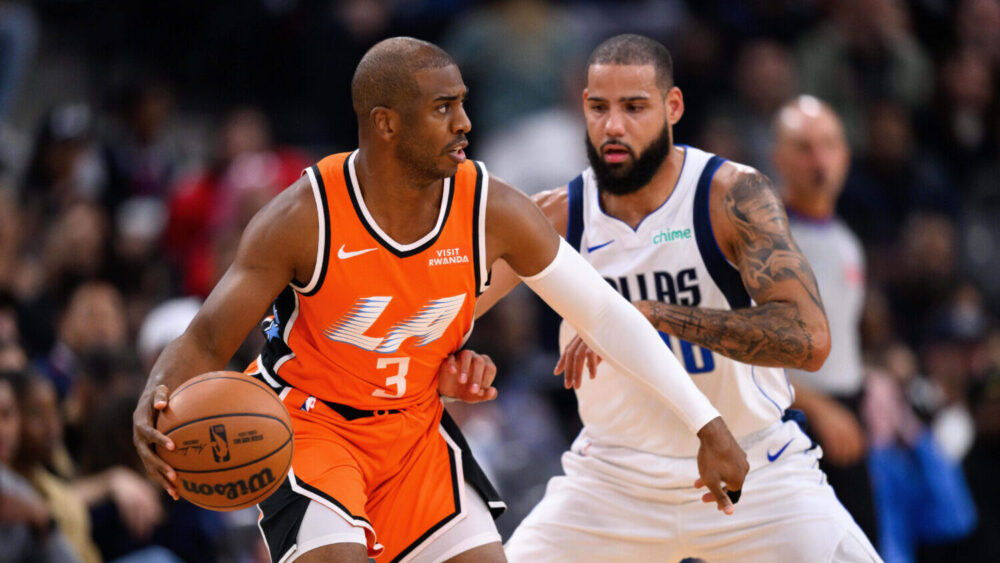Los Angeles Clippers guard Chris Paul (3) controls the ball under pressure from Dallas Mavericks fo...