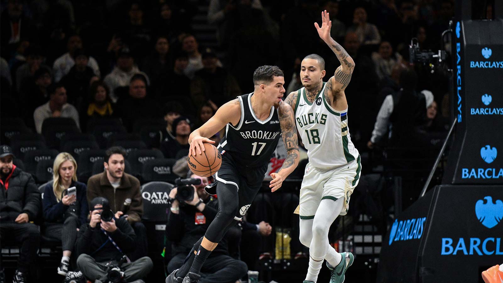 Brooklyn Nets forward Michael Porter Jr. (17) looks to shoot the ball as Milwaukee Bucks forward Kyle Kuzma (18) defends during the first half at Barclays Center.