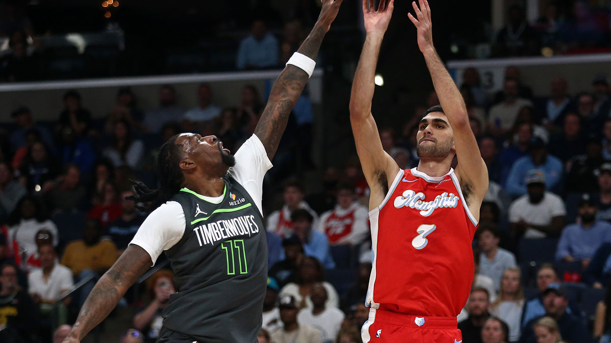 Memphis Grizzlies forward Santi Aldama (7) shoots for three as Minnesota Timberwolves center Naz Reid (11) defends during the second quarter at FedExForum