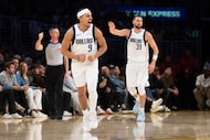 Dallas Mavericks guard Ryan Nembhard (9) reacts after scoring a basket during the second...