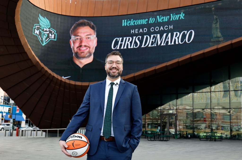 New New York Liberty head coach Chris DeMarco poses outside in front of the plaza marquee at the Barclays Center in Brooklyn, New York, Tuesday, December 10, 2025. DeMarco met with the New York media during a press conference.