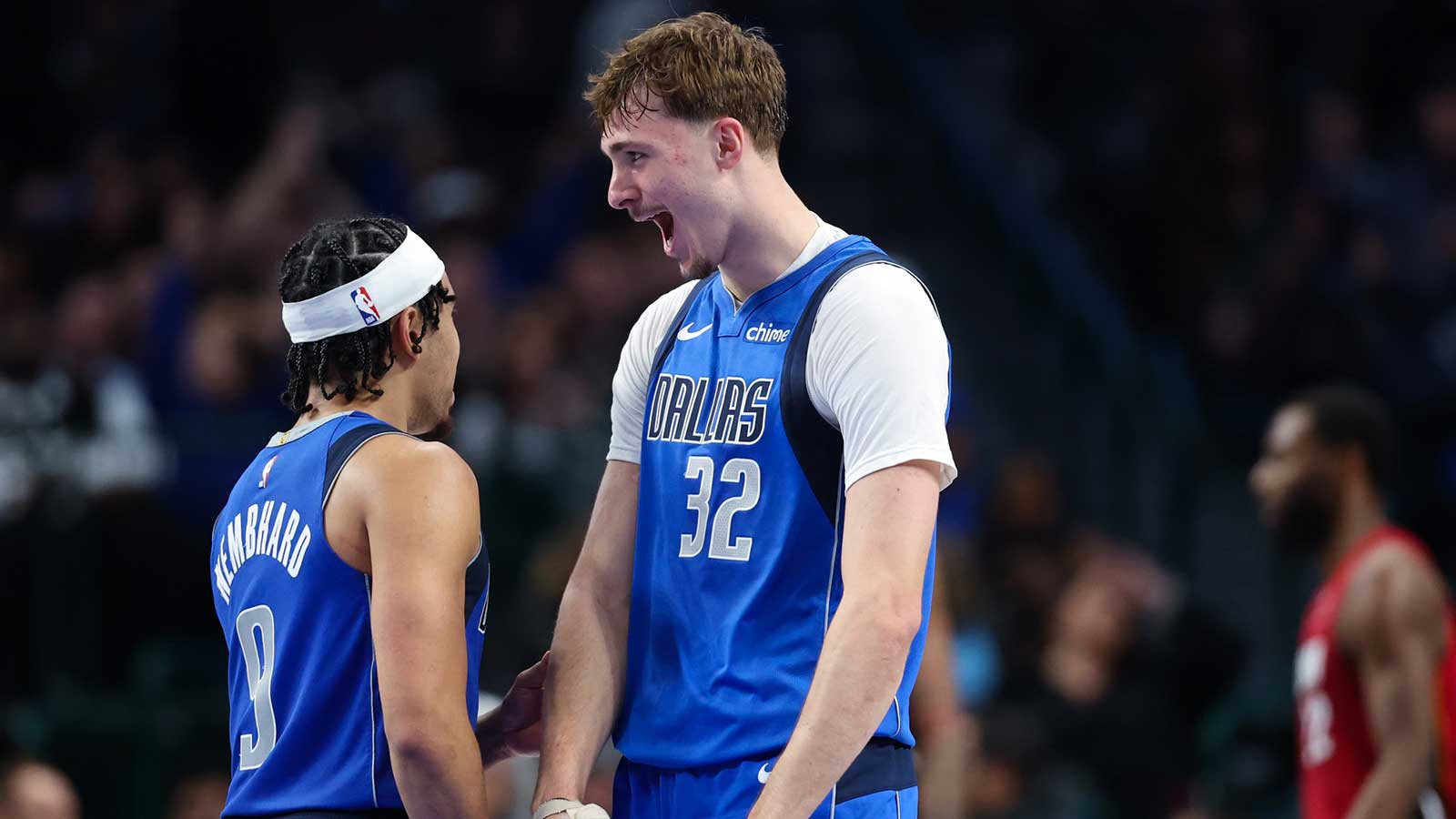 Dallas Mavericks forward Cooper Flagg (32) celebrates with Dallas Mavericks guard Ryan Nembhard (9) after scoring during the fourth quarter against the Miami Heat at American Airlines Center