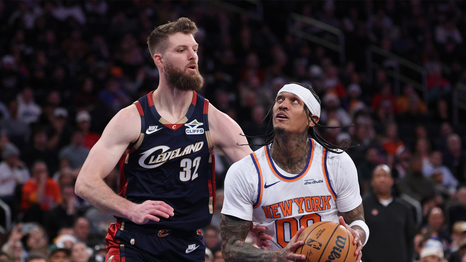 New York Knicks guard Jordan Clarkson (00) looks to the basket as Cleveland Cavaliers forward Dean Wade (32) defends during the second half at Madison Square Garden. Mandatory Credit: Vincent Carchietta-Imagn Images
