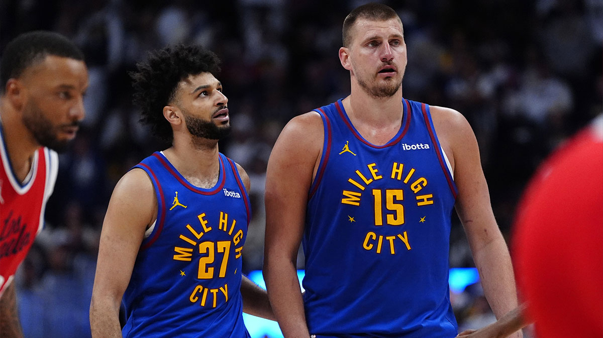 Denver Nuggets center Nikola Jokic (15) and Denver Nuggets guard Jamal Murray (27) during overtime against the LA Clippers at Ball Arena.