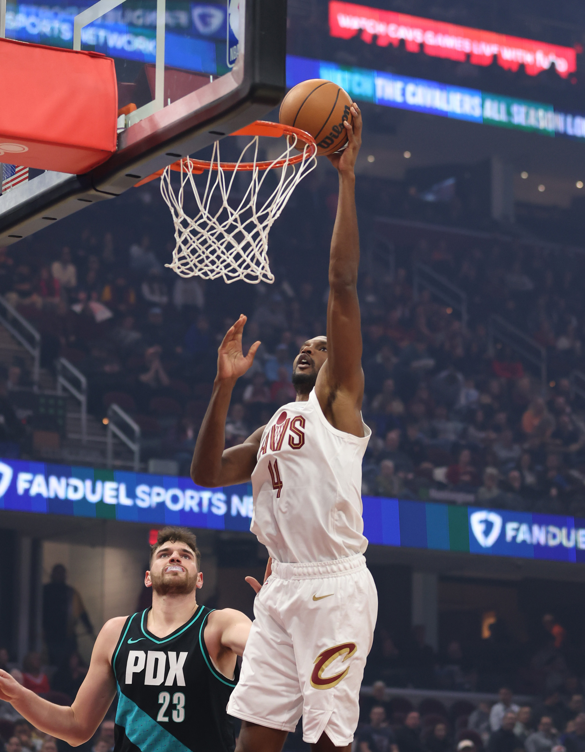 Cleveland Cavaliers center Evan Mobley beats Portland Trail Blazers center Donovan Clingan to the rim for two in the first half of play. 
