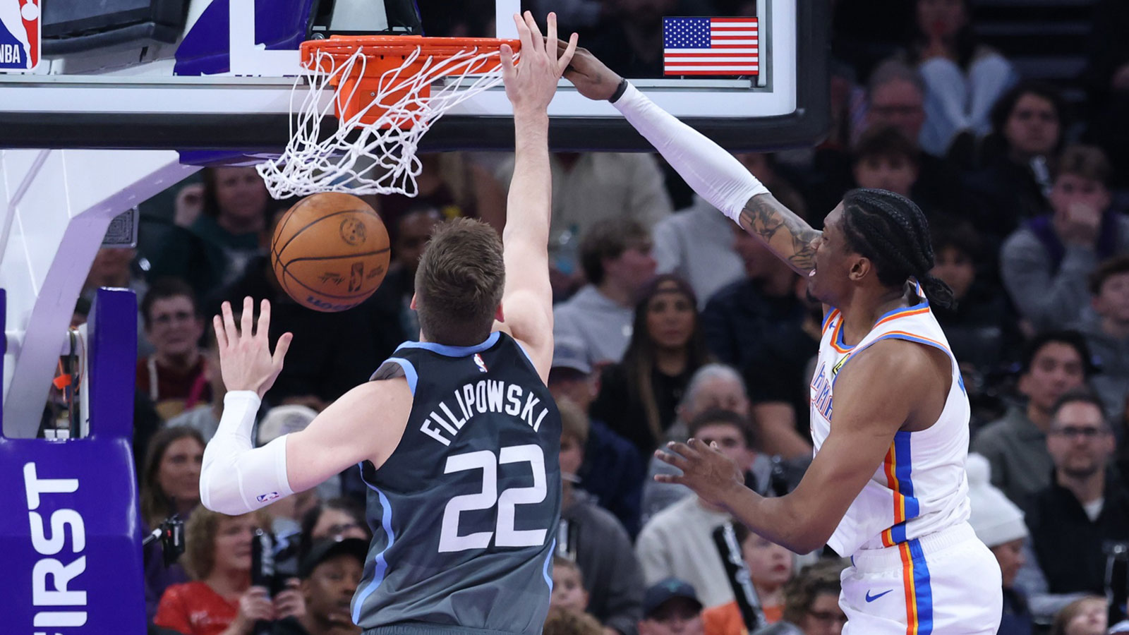 Oklahoma City Thunder guard Jalen Williams (8) dunks the ball against Utah Jazz forward Kyle Filipowski (22) during the second half at Delta Center.