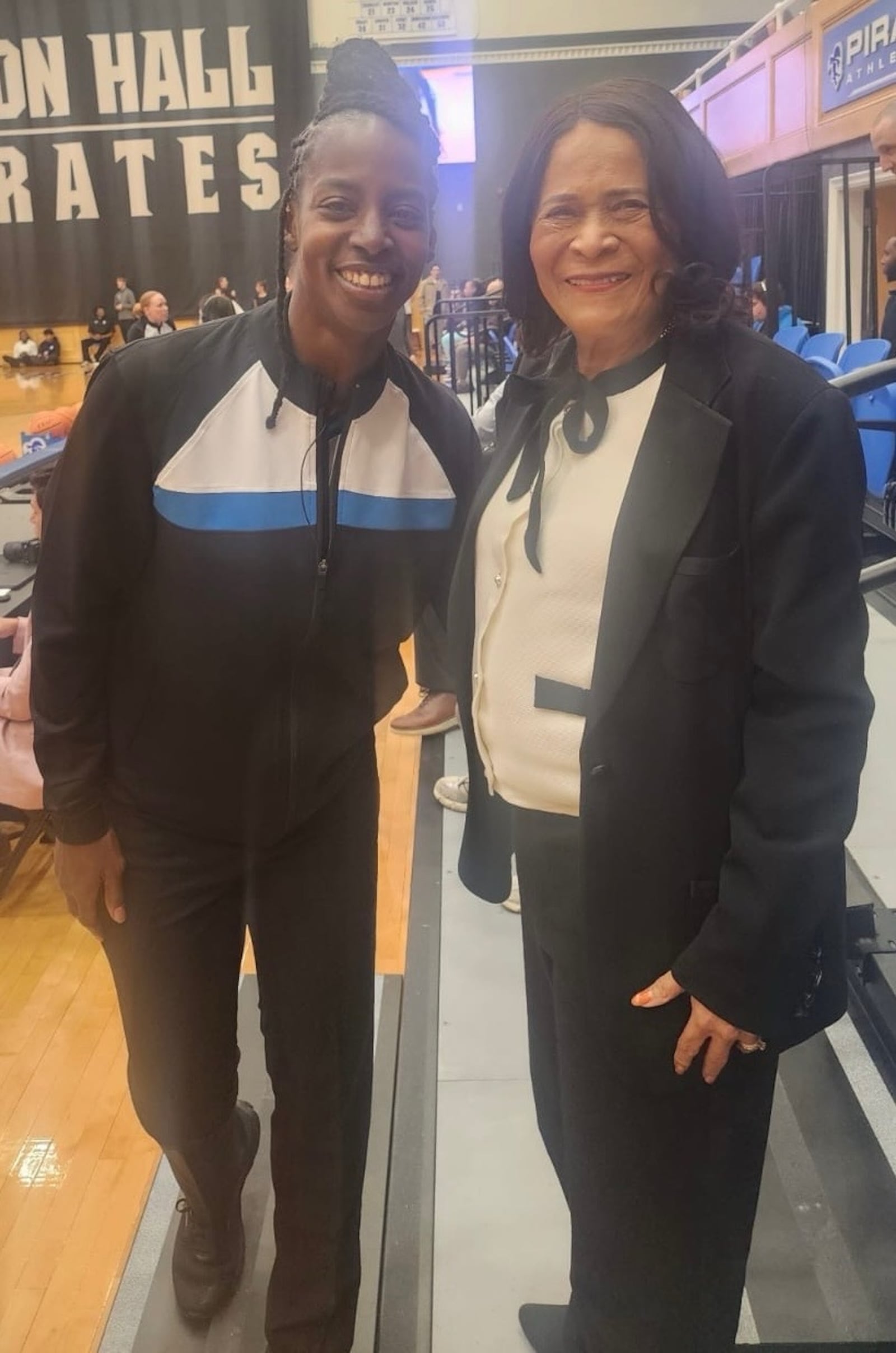 College basketball official Linda Miles, a former Rutgers University basketball player, poses for a photo with her former basketball coach Vivian Stringer during a recent game at Seton Hall. CONTRIBUTED PHOTO