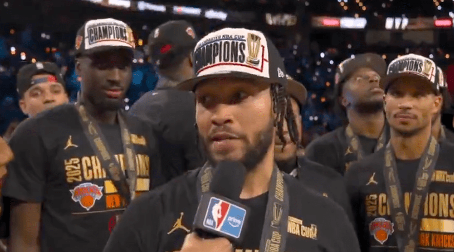 Jalen Brunson #11 of the New York Knicks is all smiles after he is presented with the NBA Cup MVP trophy after winning the NBA Cup.