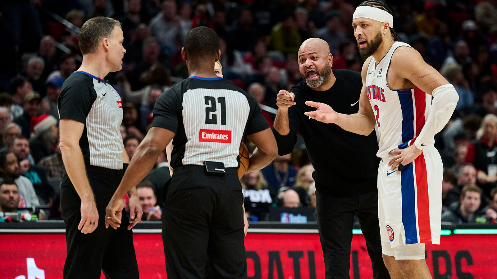 Detroit Pistons head coach J.B. Bickerstaff is given a technical foul shortly after reacting toward a referee with guard Cade Cunningham (2) during the second half against the Portland Trail Blazers at Moda Center.