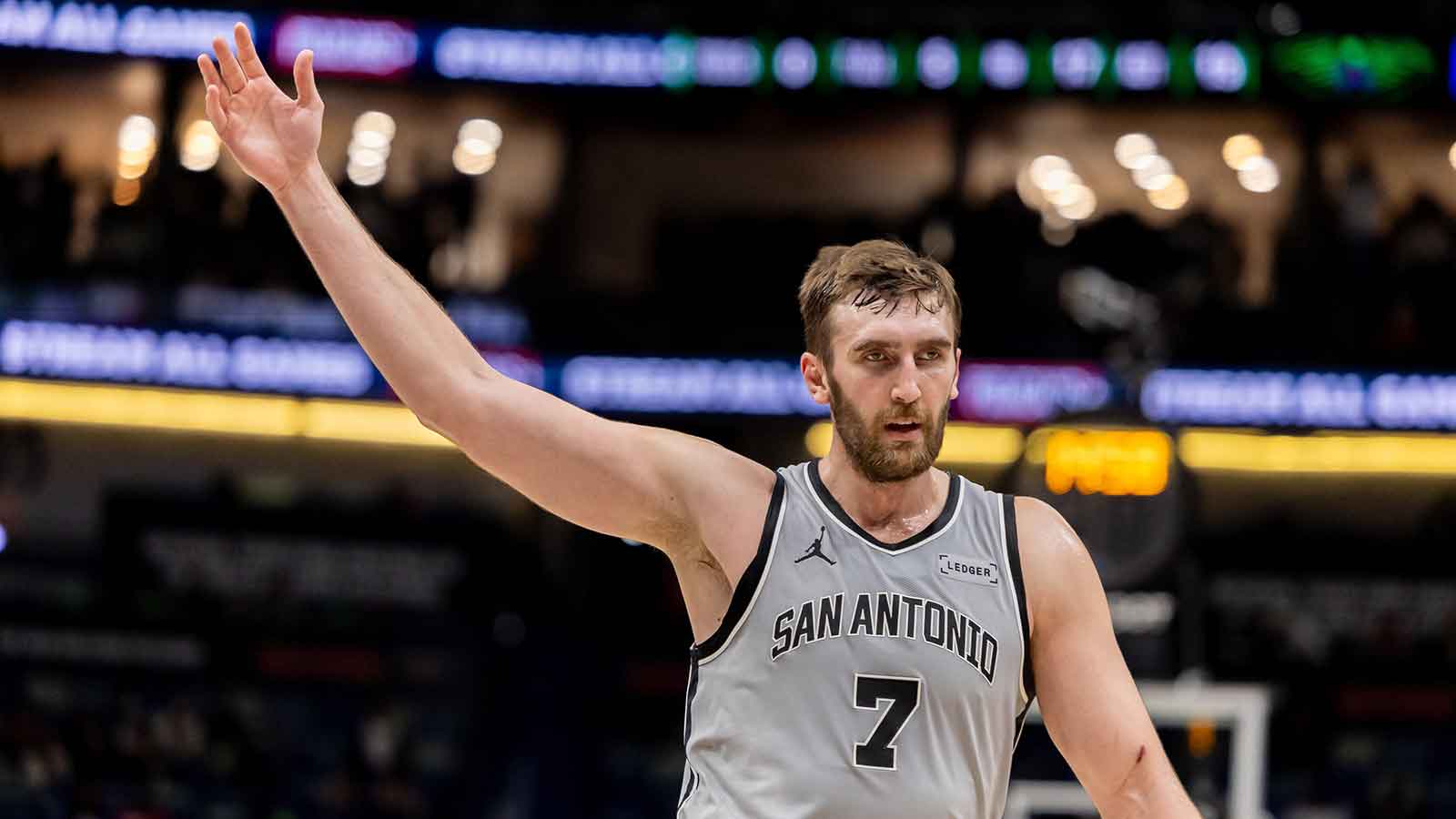 San Antonio Spurs center/forward Luke Kornet (7) waves to the crowd as heads in for halftime against the New Orleans Pelicans during the first half at Smoothie King Center.