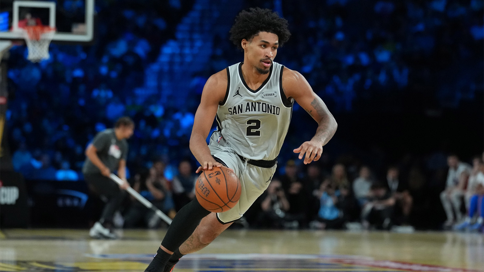San Antonio Spurs guard Dylan Harper (2) brings the ball up court against the Oklahoma City Thunder during the third quarter at T-Mobile Arena.