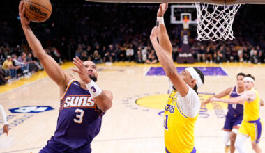Phoenix Suns forward Dillon Brooks, left, shoots as Los Angeles Lakers center Jaxson Hayes...