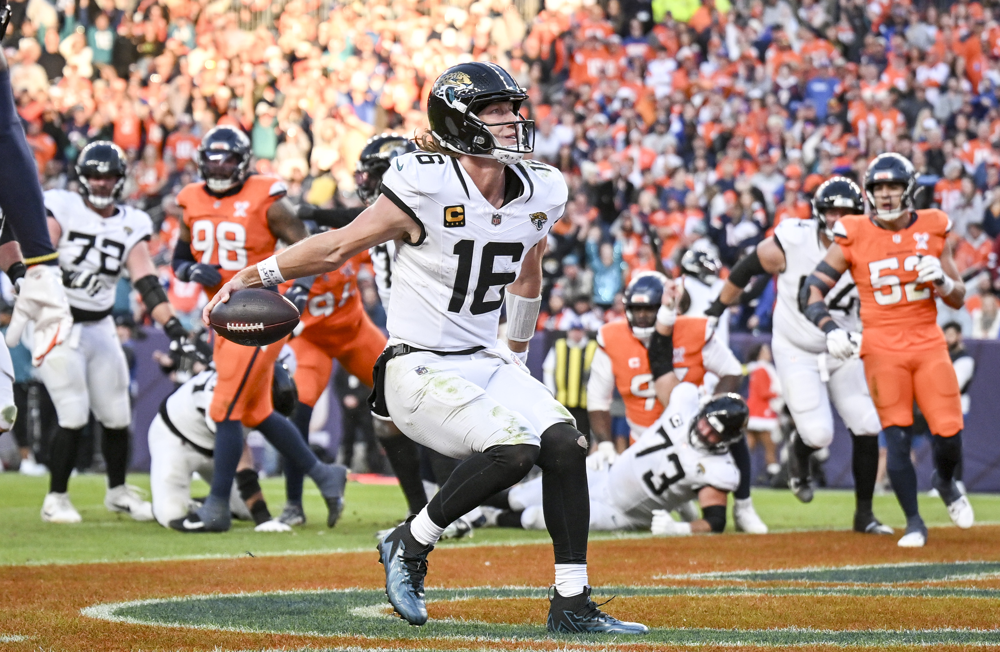 Trevor Lawrence (16) of the Jacksonville Jaguars celebrates rushing for...