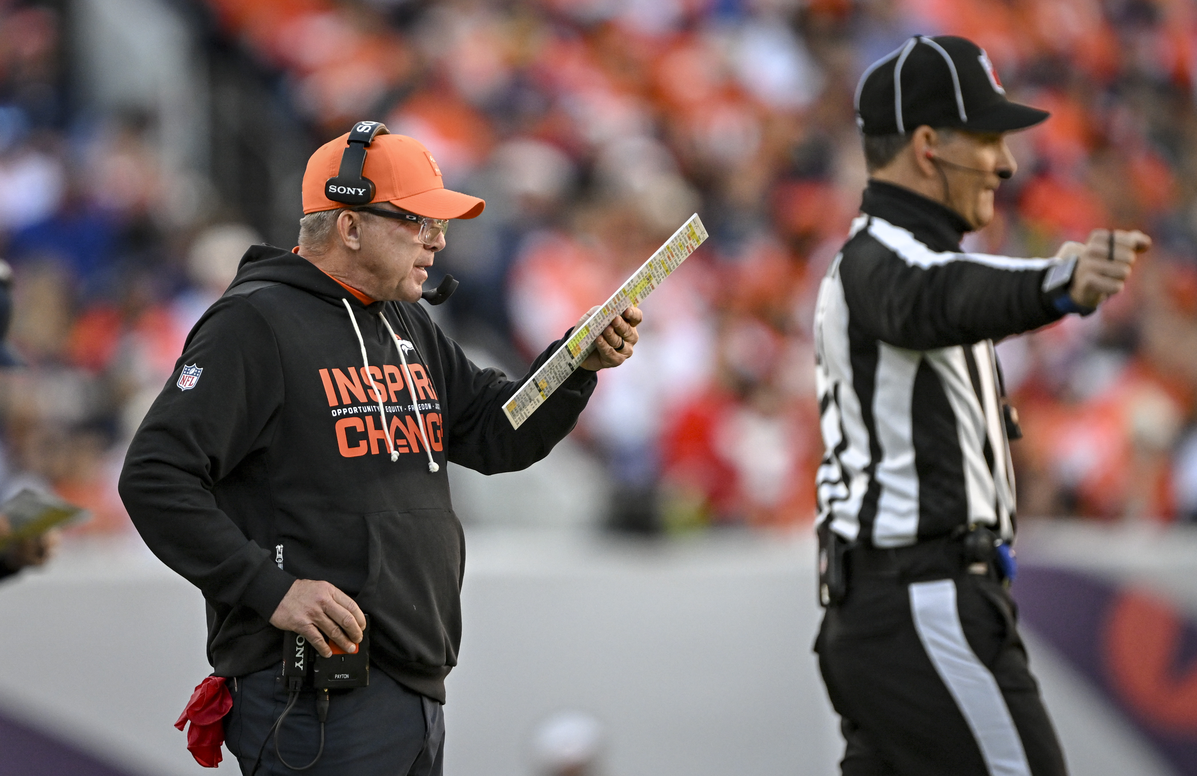 Head coach Sean Payton of the Denver Broncos locks in...