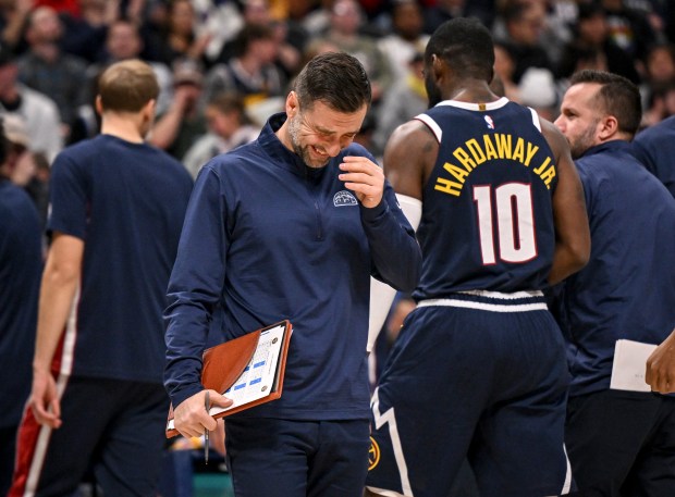 DENVER , CO - DECEMBER 18: Assistant coach Ognjen Stojakovic laughs as the Orlando Magic take a timeout during the fourth quarter of the Nuggets' 126-115 win at Ball Arena in Denver, Colorado on Thursday, December 18, 2025. (Photo by AAron Ontiveroz/The Denver Post)
