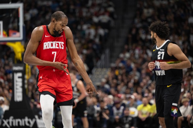 Houston Rockets forward Kevin Durant (7) celebrates a three-pointer during a 115-101 win over the Denver Nuggets during the second half on Saturday, Dec. 20, 2025, at Ball Arena in Denver. (Photo by Timothy Hurst/The Denver Post)