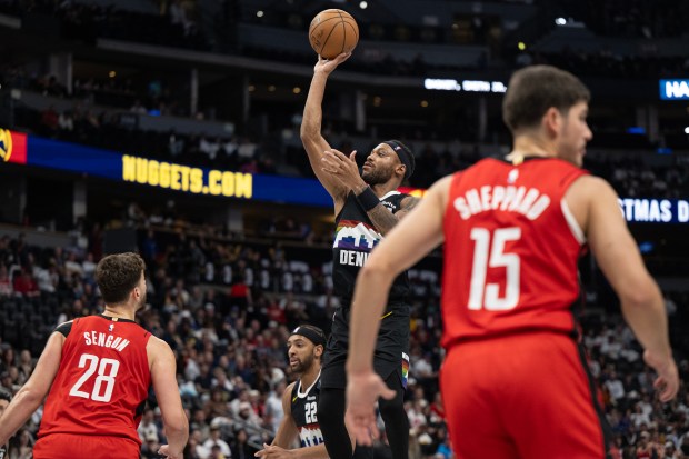 Denver Nuggets guard/forward Bruce Brown (11) puts up a shot over Houston Rockets center Alperen Sengun (28) during the second half on Saturday, Dec. 20, 2025, at Ball Arena in Denver. (Photo by Timothy Hurst/The Denver Post)