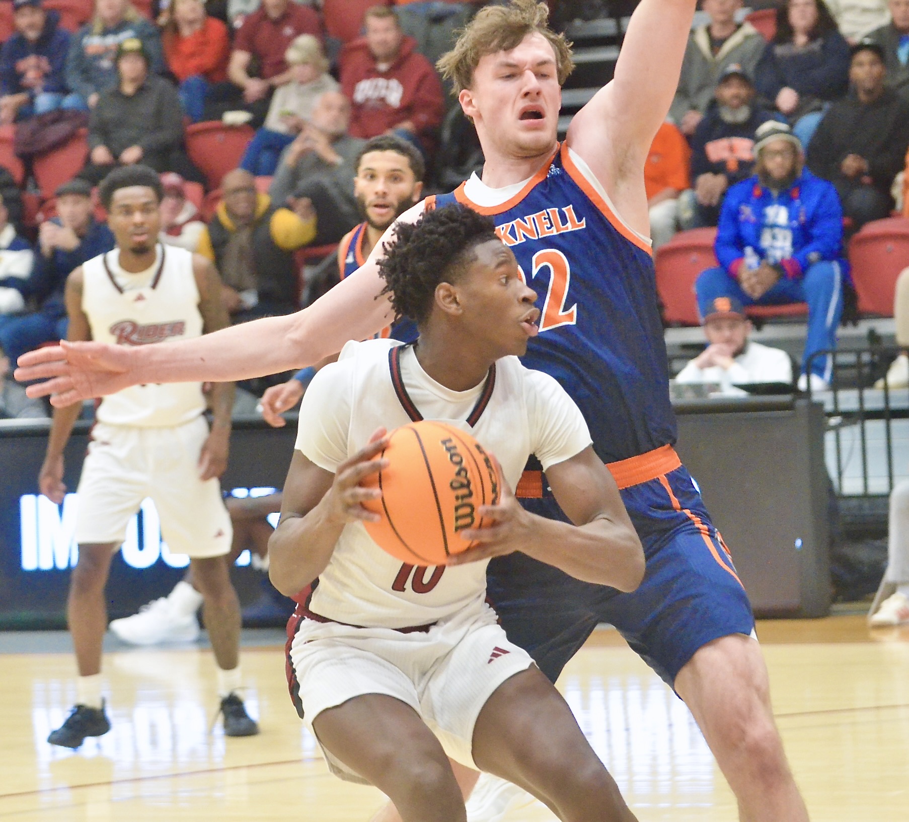 Rider’s AB Coulibaly, 10, drives to the basket as Bucknell’s...