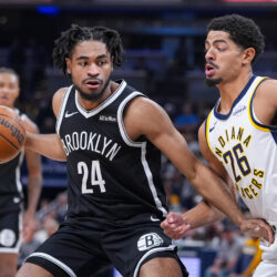 Brooklyn Nets guard Cam Thomas (24) drives on Indiana Pacers guard Ben Sheppard (26) during the first half of an NBA basketball game in Indianapolis, Wednesday, Nov. 5, 2025. (AP Photo/Michael Conroy)
