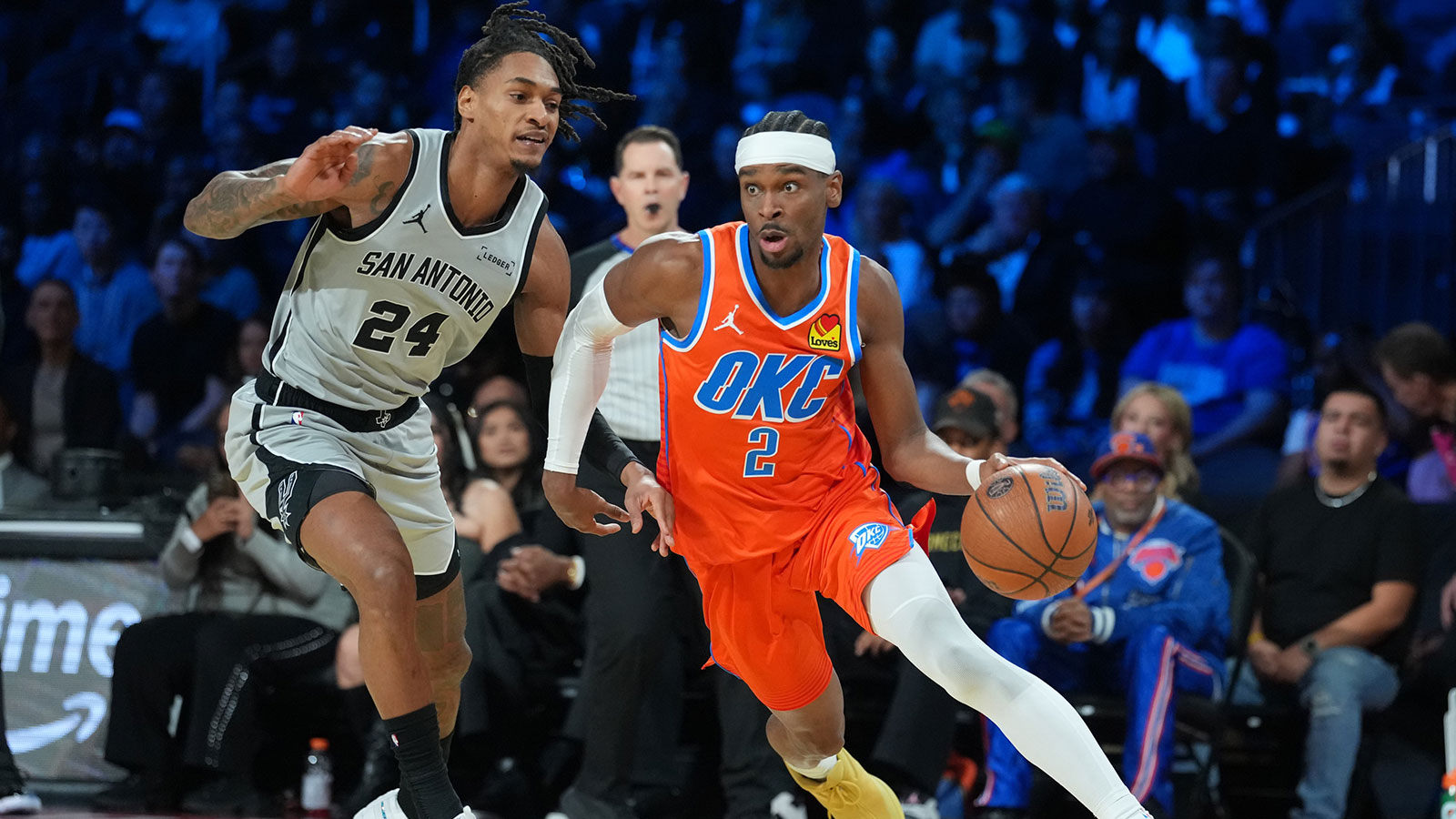 Thunder guard Shai Gilgeous-Alexander (2) works around San Antonio Spurs guard Devin Vassell (24) during the first quarter at T-Mobile Arena